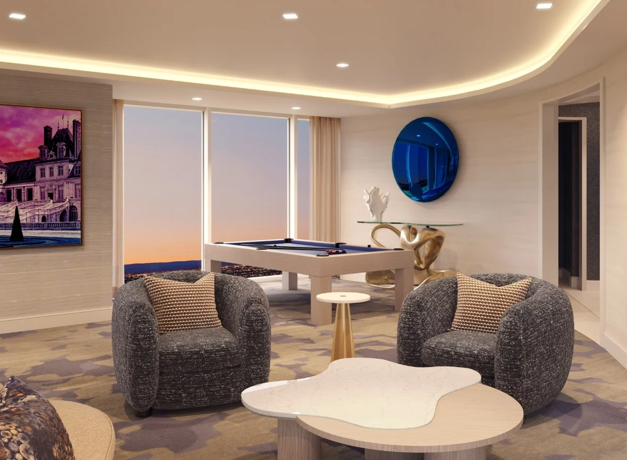 Resort lounge with pool table and sunset view.